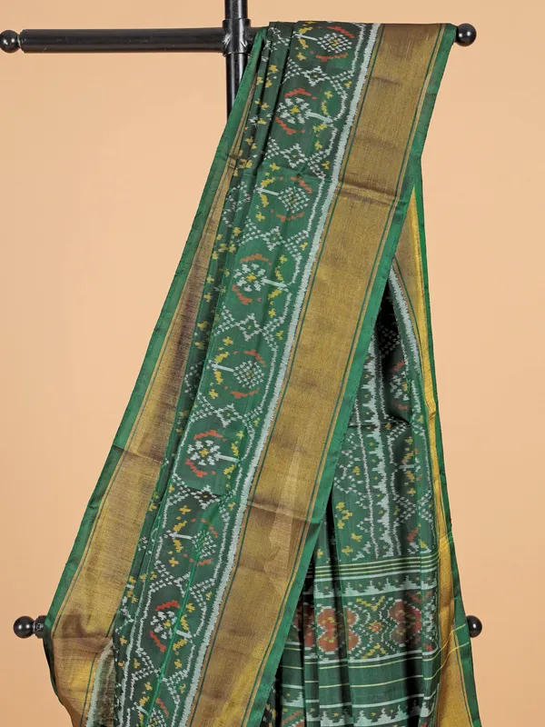 Dark green saree in bandhej silk for festive