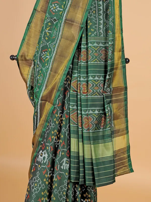 Dark green saree in bandhej silk for festive