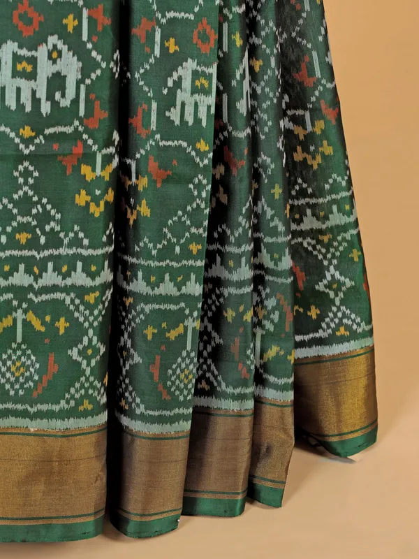 Dark green saree in bandhej silk for festive