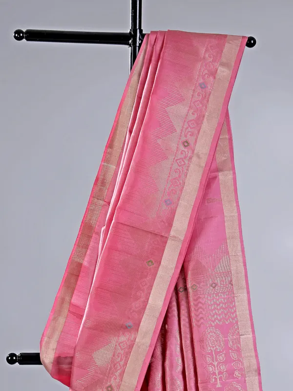 Pink silk saree with gleaming zari accents
