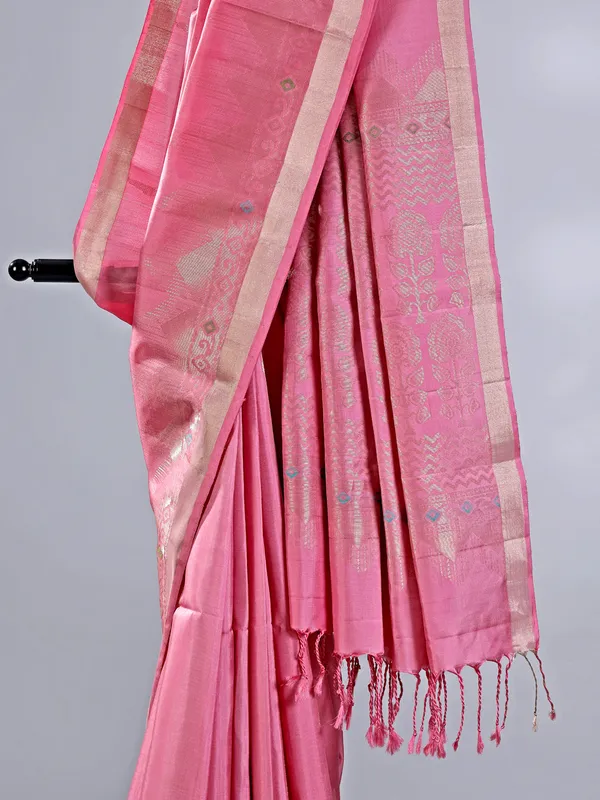 Pink silk saree with gleaming zari accents