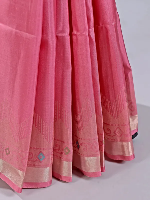 Pink silk saree with gleaming zari accents