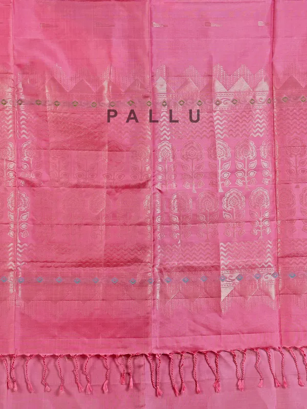 Pink silk saree with gleaming zari accents