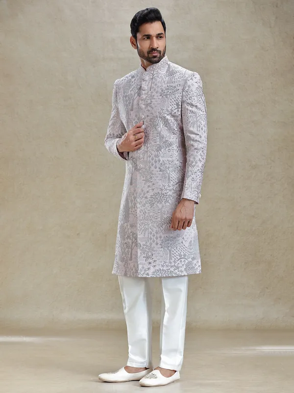 Pink silk sherwani in silver embroidery pattern