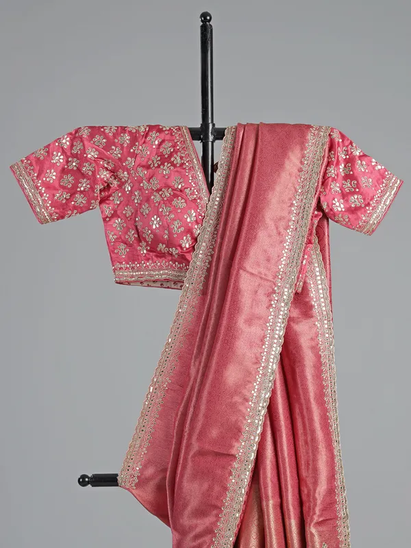 Pink soft tissue saree with cutdana V neck blouse