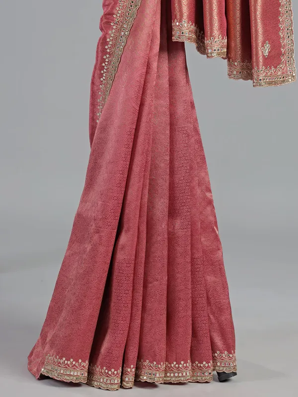 Pink soft tissue saree with cutdana V neck blouse