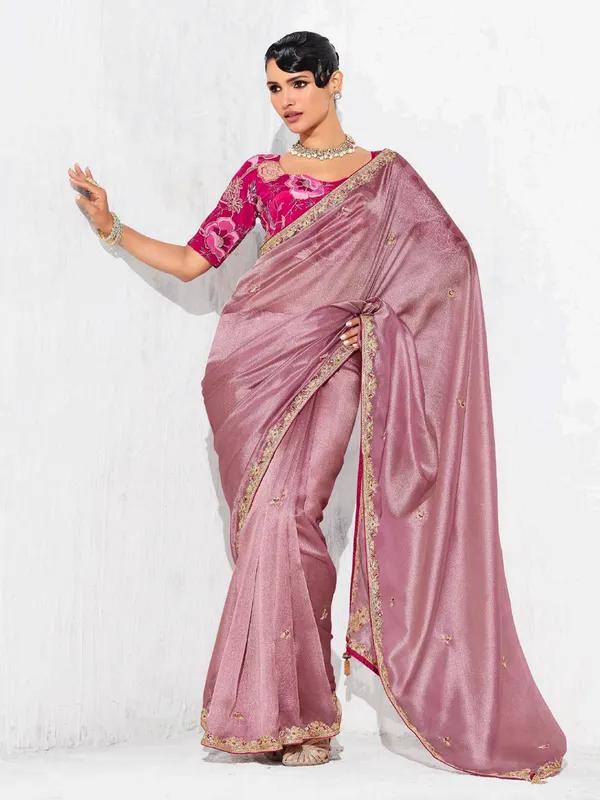 Pink tissue silk saree detailed with resham and sequins work