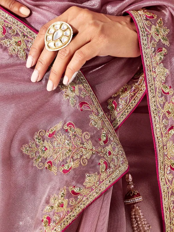 Pink tissue silk saree detailed with resham and sequins work