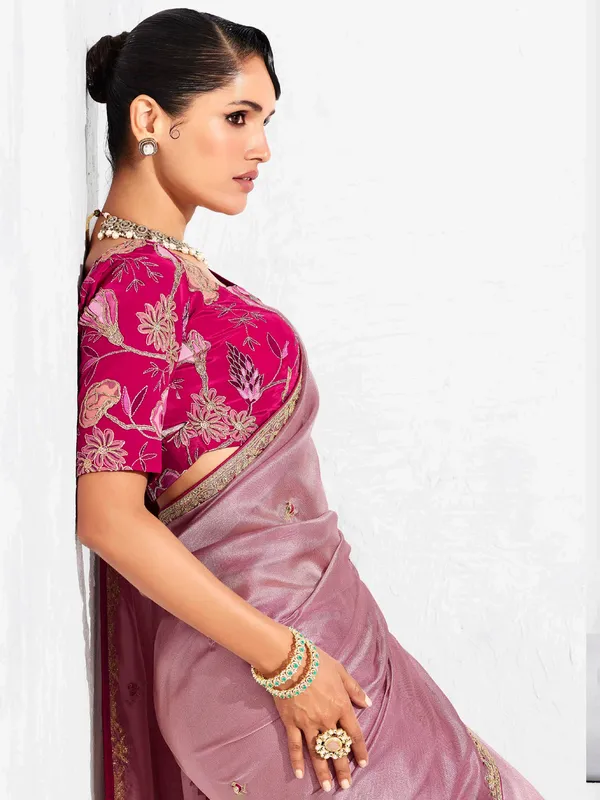 Pink tissue silk saree detailed with resham and sequins work