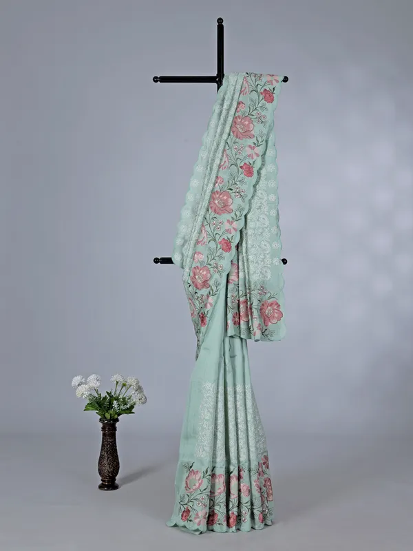 Pista green art silk saree with delicate embroidery charm