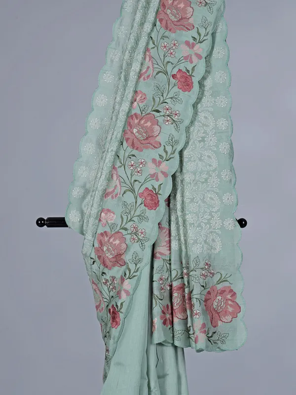 Pista green art silk saree with delicate embroidery charm