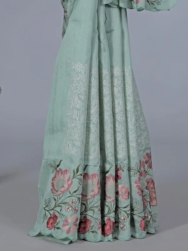 Pista green art silk saree with delicate embroidery charm