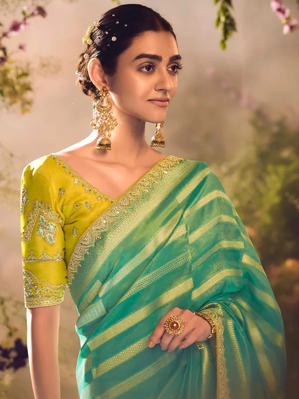 Pista green banarasi tissue saree with zardosi embellishments