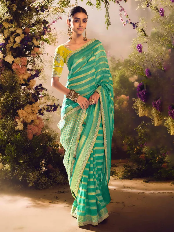 Pista green banarasi tissue saree with zardosi embellishments