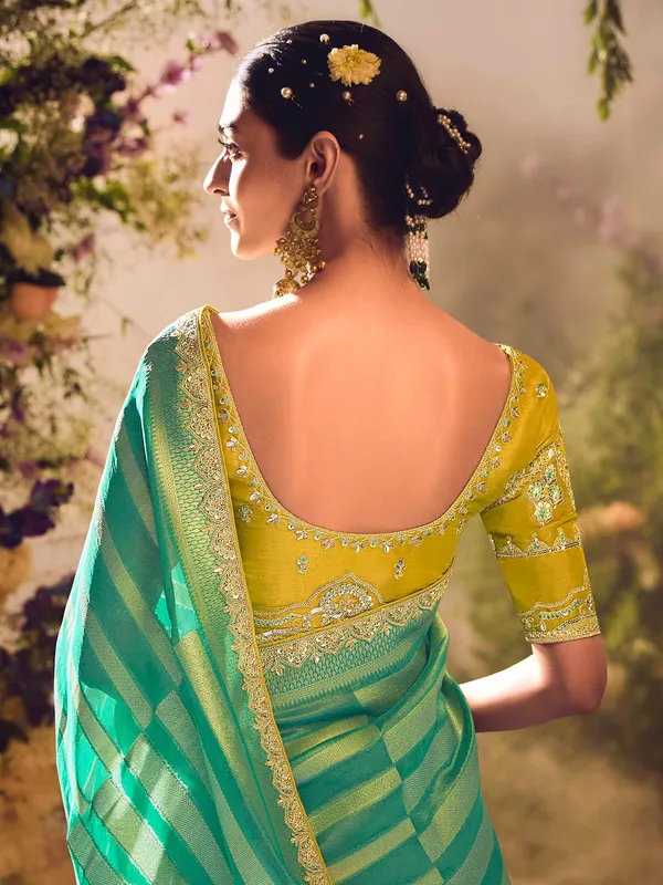 Pista green banarasi tissue saree with zardosi embellishments