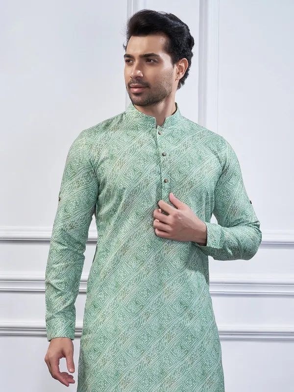 Pista green cotton printed kurta suit for festive wear