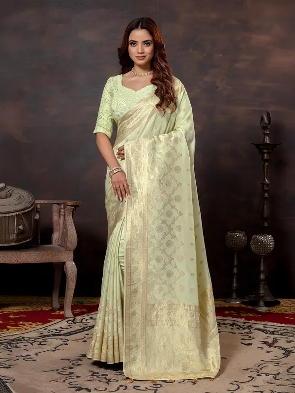Pista green dola silk saree with zari glow