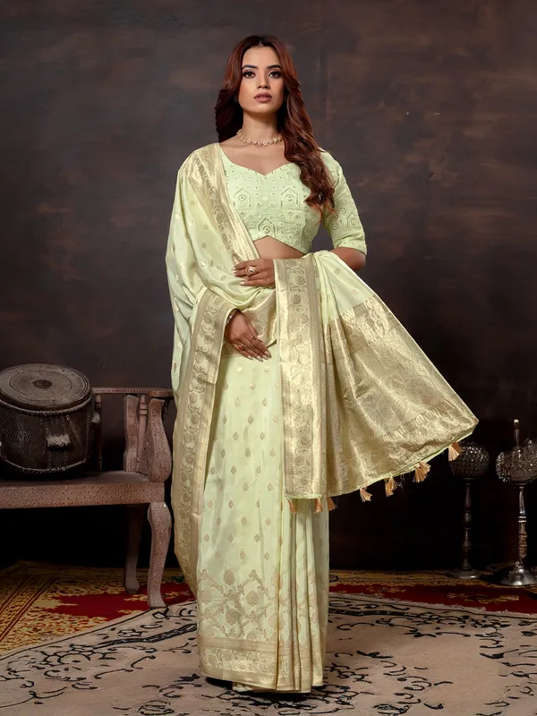 Pista green dola silk saree with zari glow