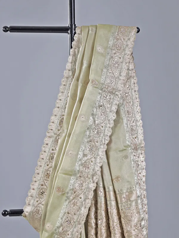 Pista green heavily embellished silk saree for weddings