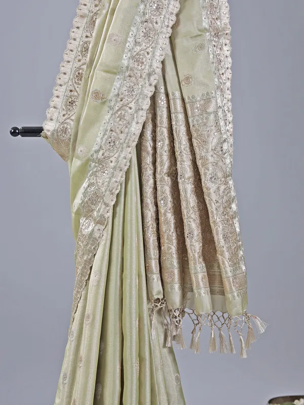 Pista green heavily embellished silk saree for weddings