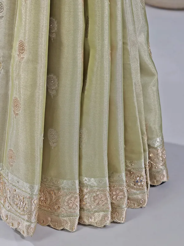 Pista green heavily embellished silk saree for weddings