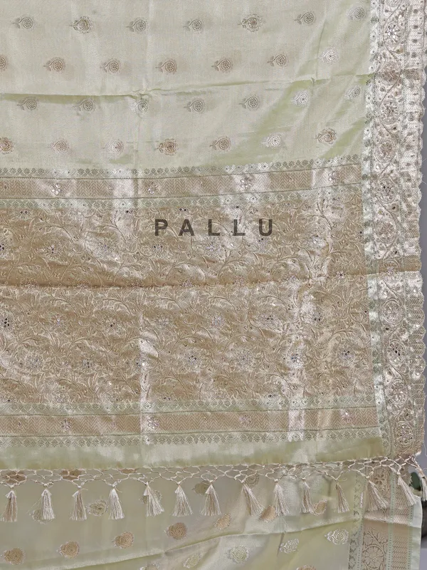 Pista green heavily embellished silk saree for weddings
