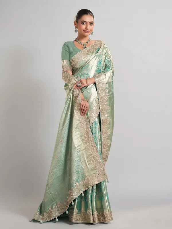 Pista green kanjivaram silk saree with elegant zari work
