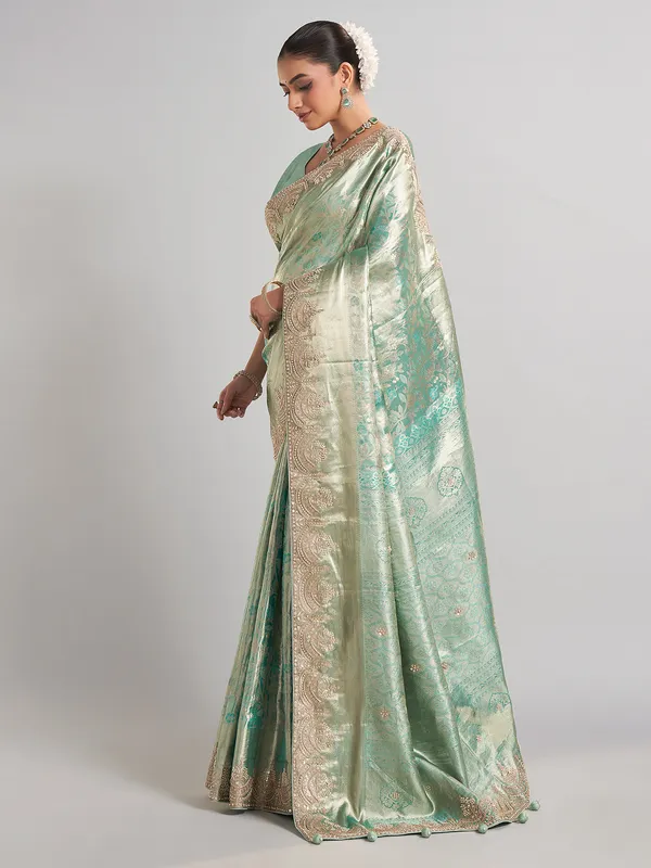 Pista green kanjivaram silk saree with elegant zari work
