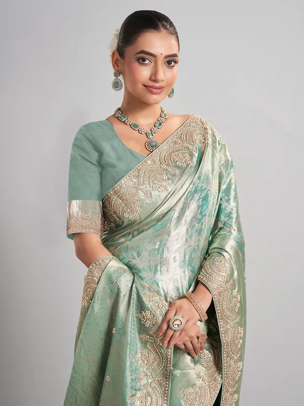 Pista green kanjivaram silk saree with elegant zari work
