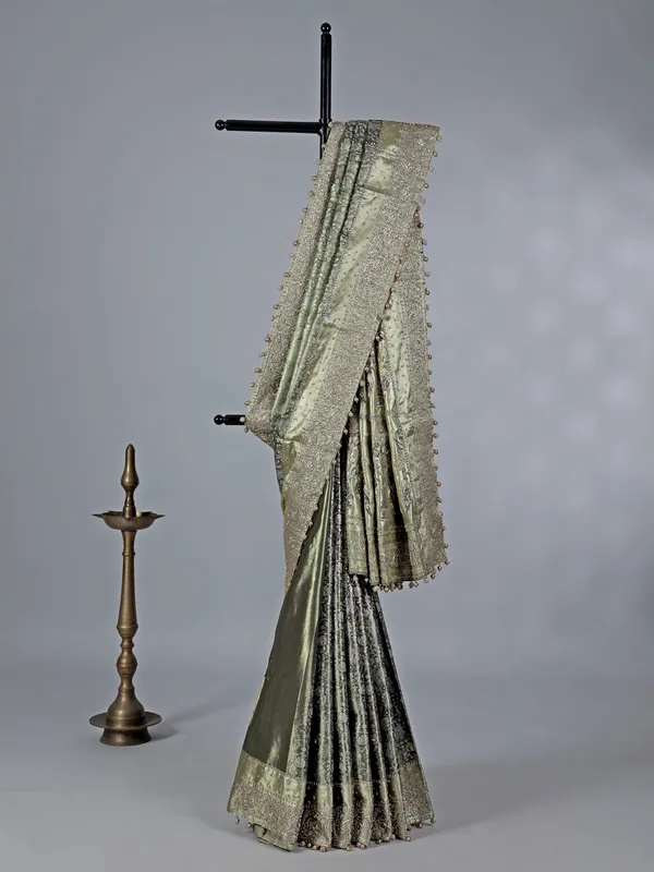 Pista green kanjivaram silk saree with ornate embellishments