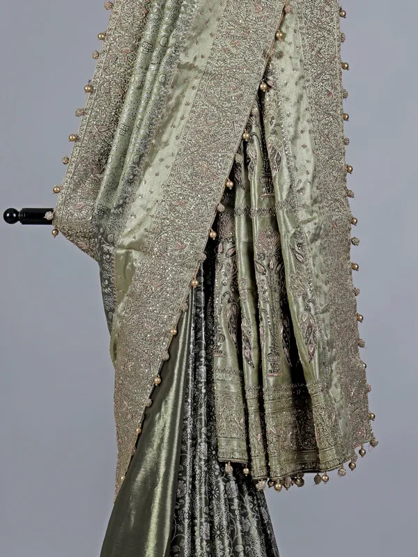 Pista green kanjivaram silk saree with ornate embellishments