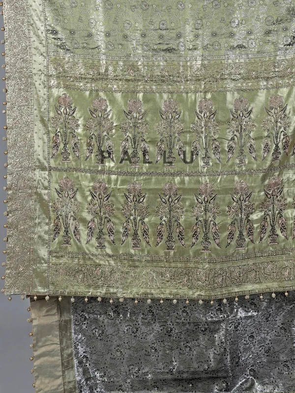 Pista green kanjivaram silk saree with ornate embellishments