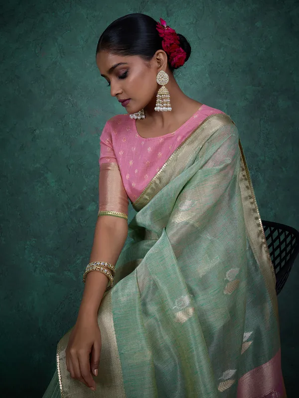 Pista green linen blend saree with zari weaving