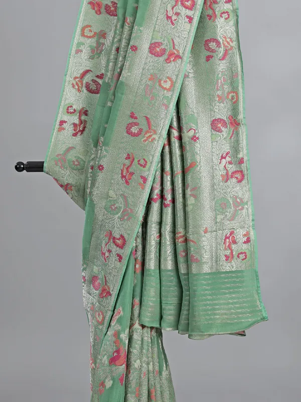 Pista green modal silk saree with colorfull motifs