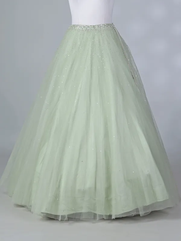 Pista green net lehenga choli with beaded design