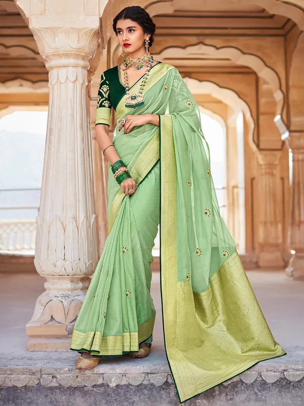 Pista green organza saree for wedding look