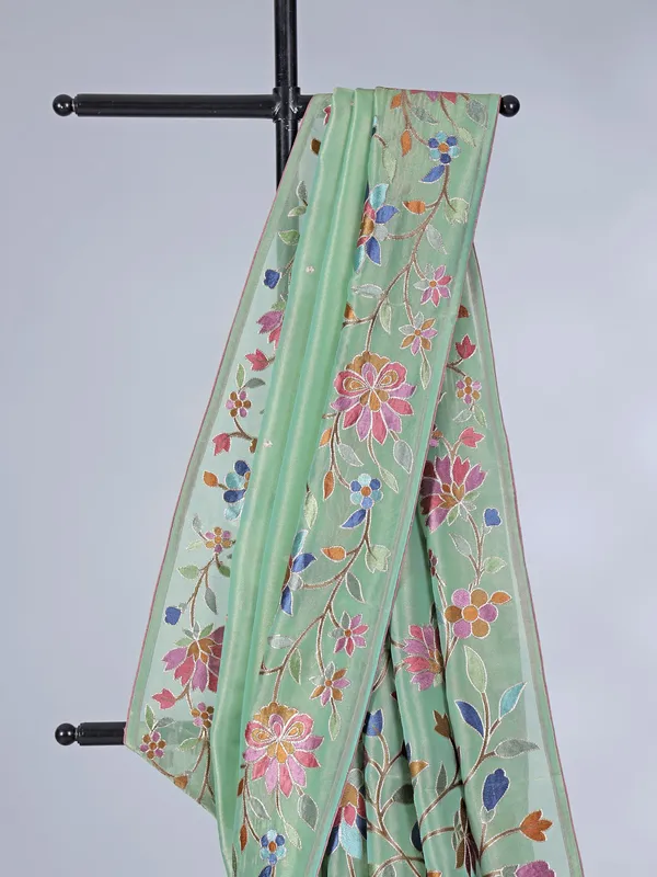 Pista green organza saree with delicate embroidery work