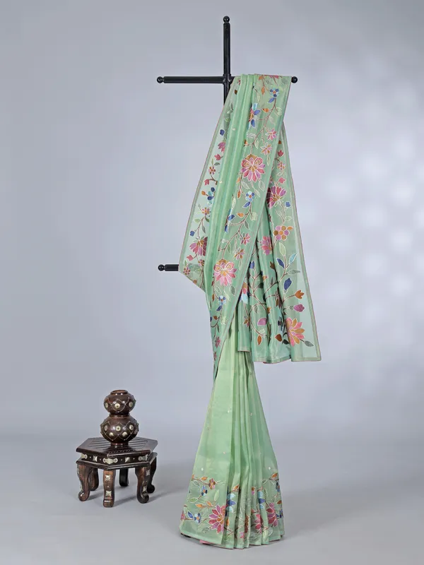 Pista green organza saree with delicate embroidery work