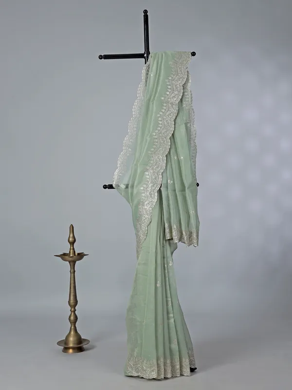 Pista green organza saree with thread work