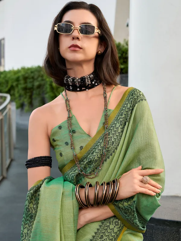 Pista green printed saree in linen tissue silk
