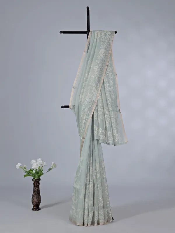 Pista green semi organza saree with refined embroidery touch