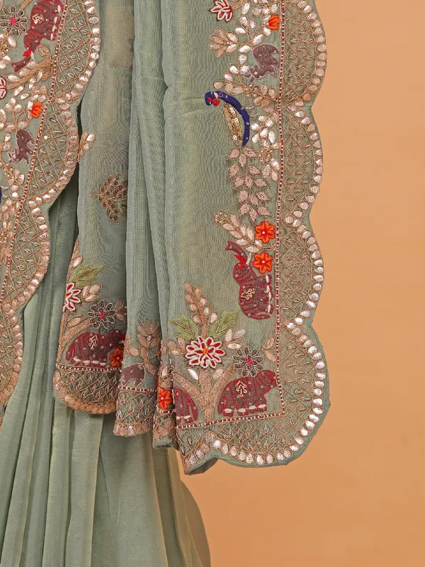 Pista green shimmer tissue silk saree