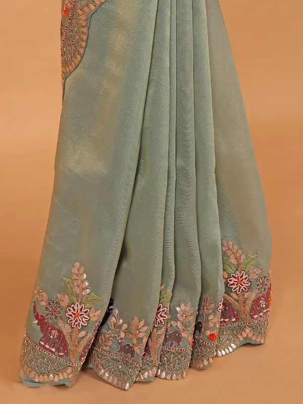 Pista green shimmer tissue silk saree