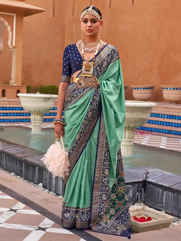 Pista green shiny patola silk saree