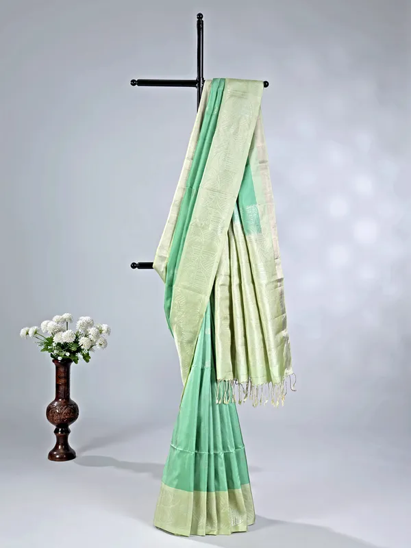 Pista green silk saree with delicate zari weaving