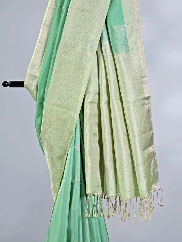 Pista green silk saree with delicate zari weaving