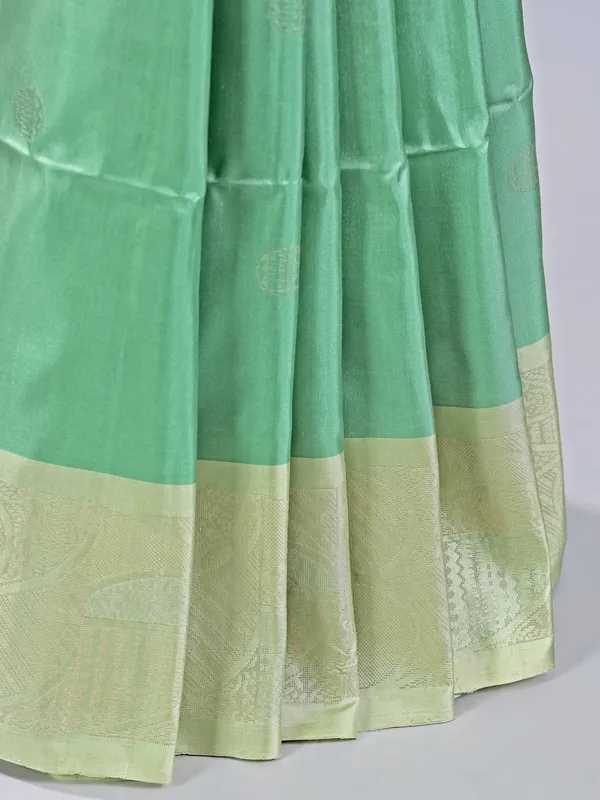 Pista green silk saree with delicate zari weaving