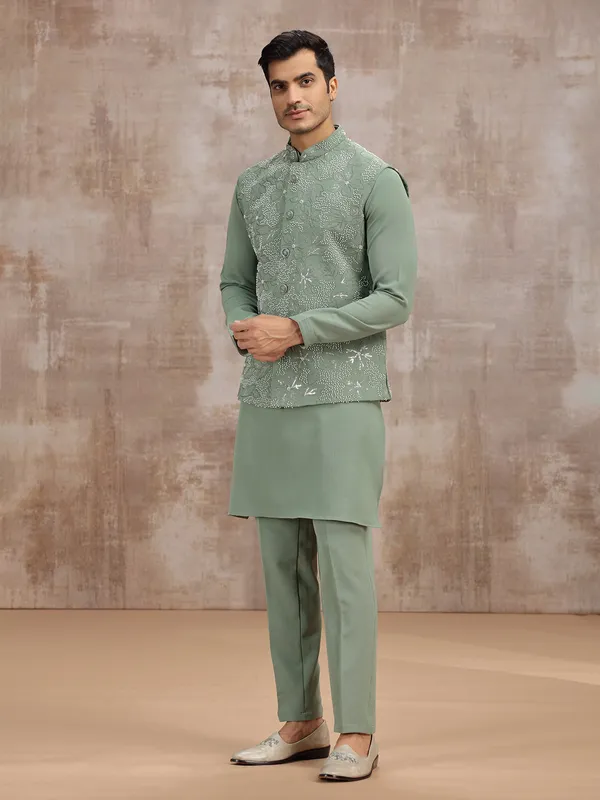 Pista green silk waistcoat set with cutdana work