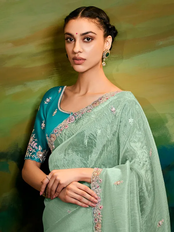 Pista green tissue silk saree for reception wear