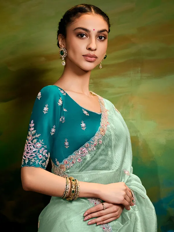 Pista green tissue silk saree for reception wear